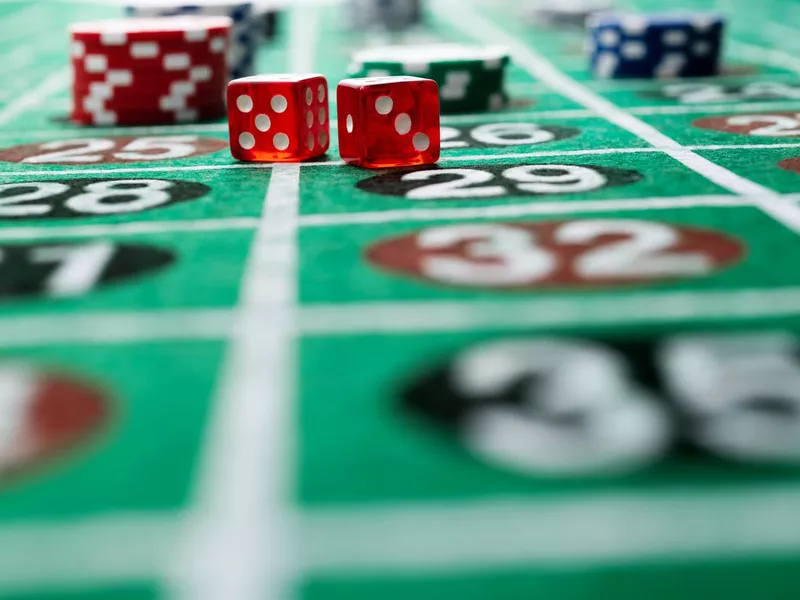 Gambling chips and dice on the roulette table