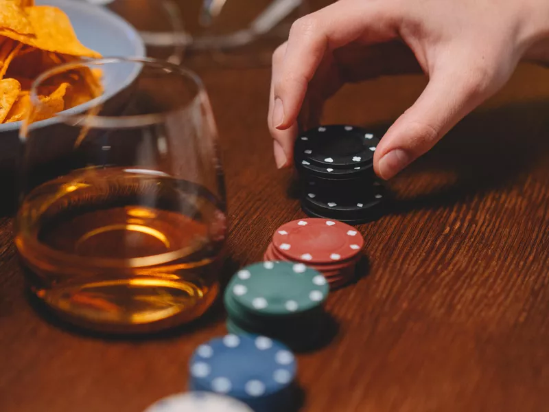 Person holding poker chips