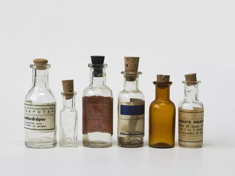 Group of small vintage translucent medicine bottles