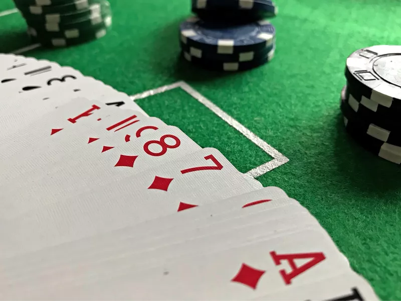 Deck of playing cards with poker chips