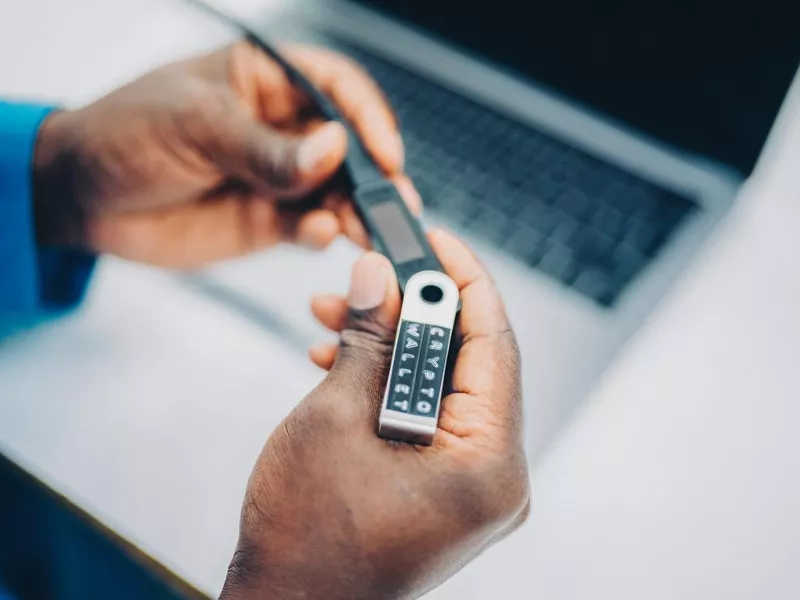 Man using crypto hardware wallet