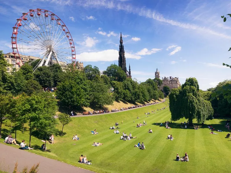 People Edinburgh lounging on grass in summer