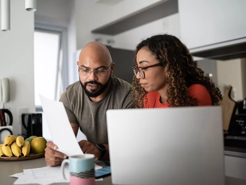 Couple doing home finances together at home