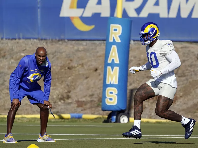 Los Angeles Rams linebacker Von Miller working wtih Reggie Scott, team vice president of sports medicine and performance