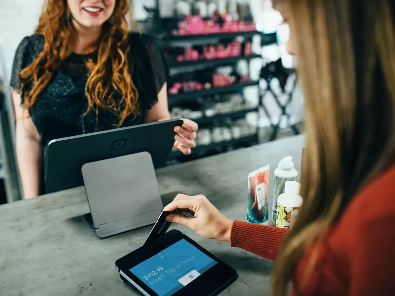 Customer making a purchase at a business