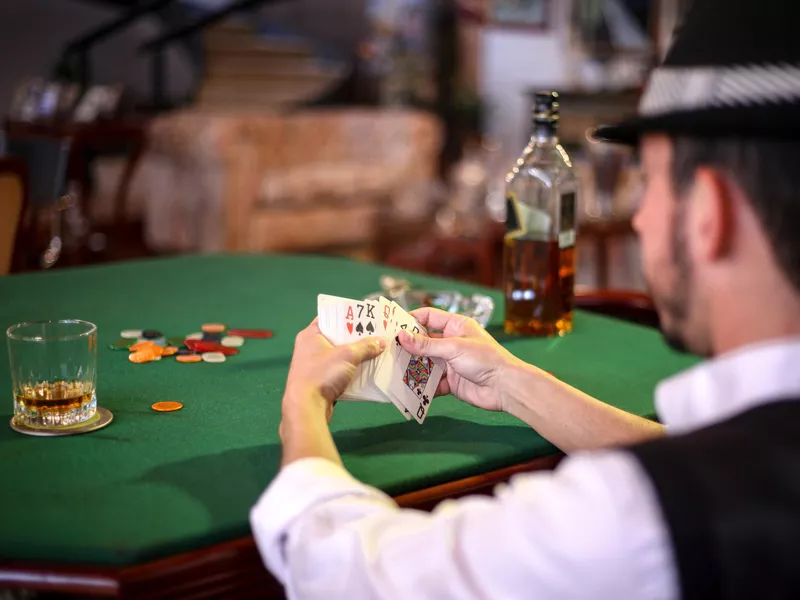 Man holding playing cards