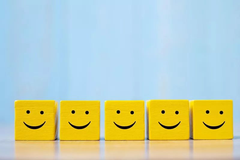 Smiles on yellow cubes