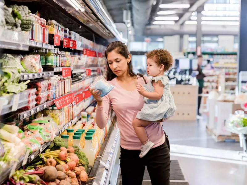 Young mother grocery shopping