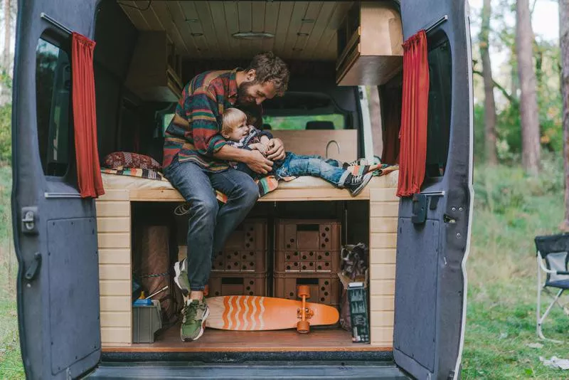 Father and son in van