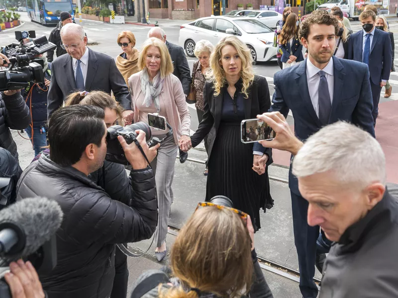 Theranos founder and CEO Elizabeth Holmes, center, her partner Billy Evans, right, and her parents