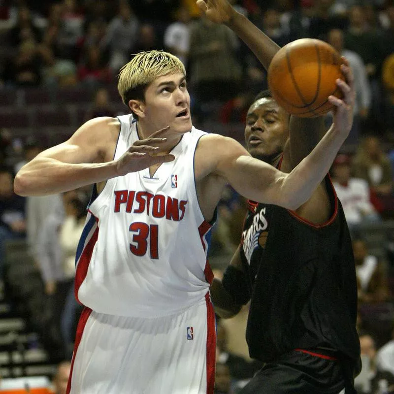 Detroit Pistons' Darko Milicic drives past Samuel Dalembert