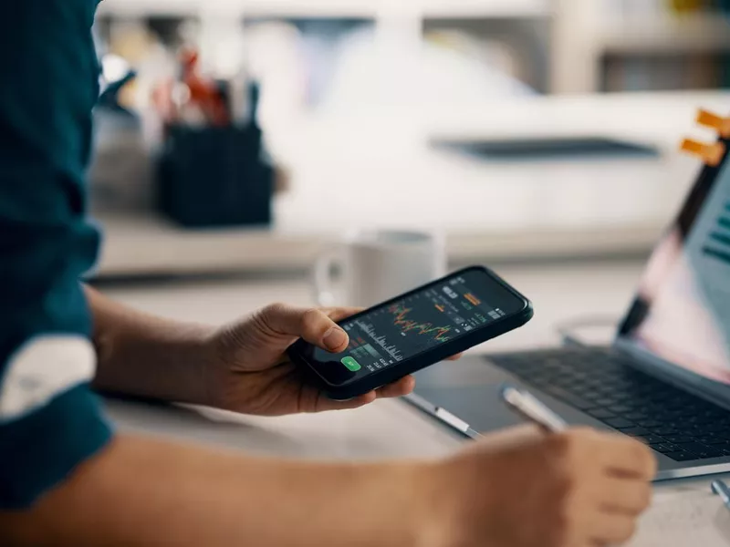 Man checking financial information on a smartphone