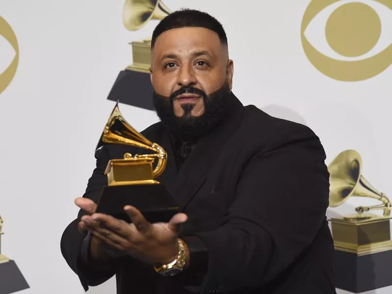 DJ Khaled poses in the press room with a Grammy