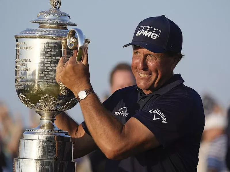 Phil Mickelson holds the Wanamaker Trophy