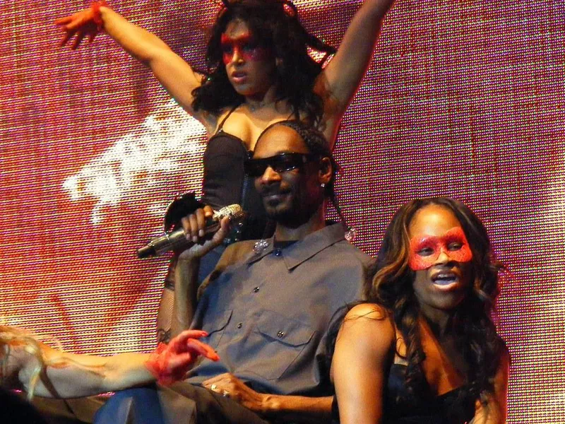 Snoop Dogg holding a microphone