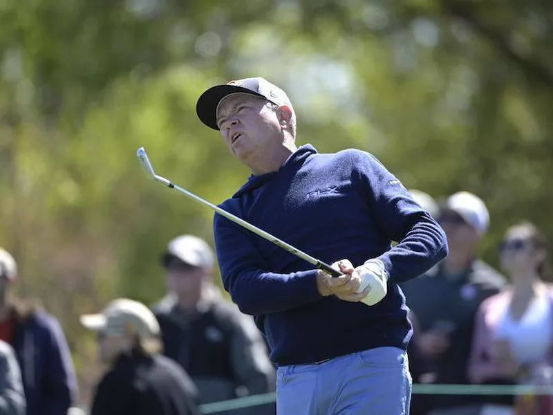 Davis Love III watches tee shot