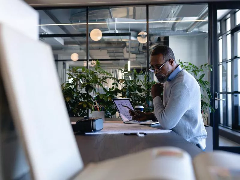 Older man working in office