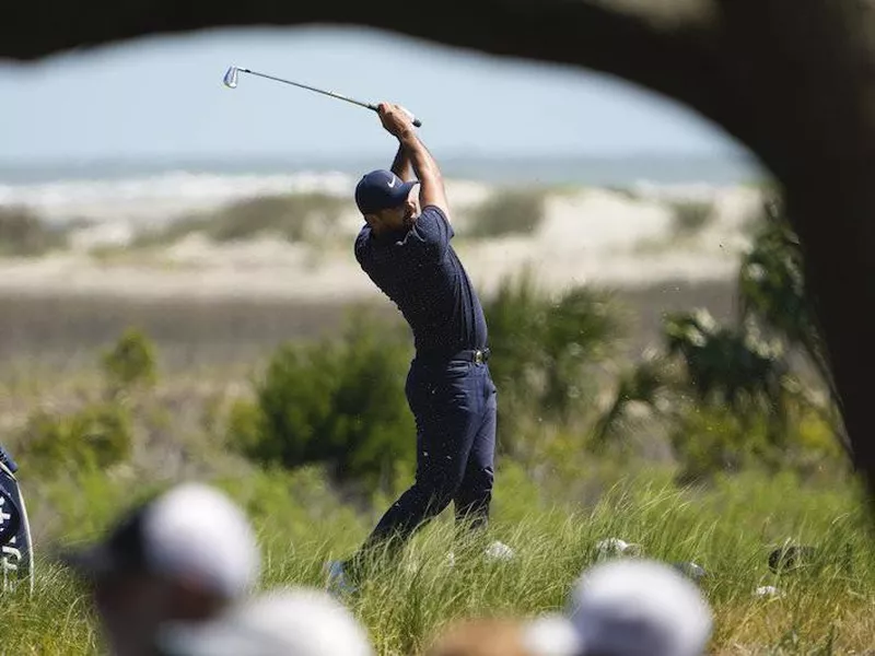 Jason Day watches his tee shot