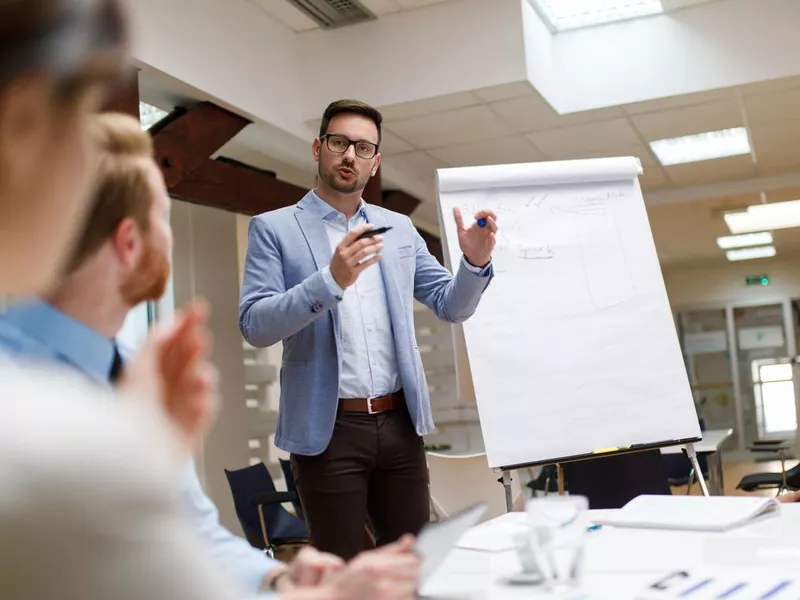 Businessman presenting new project to partners in the office