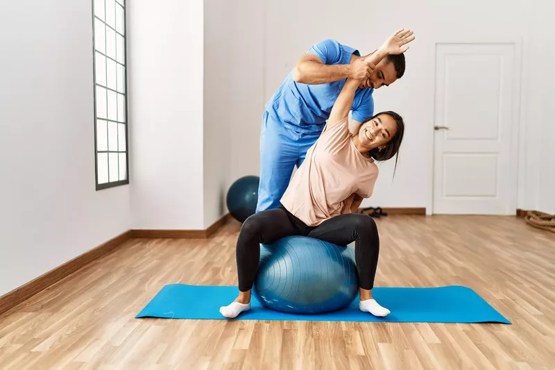 PT on yoga ball