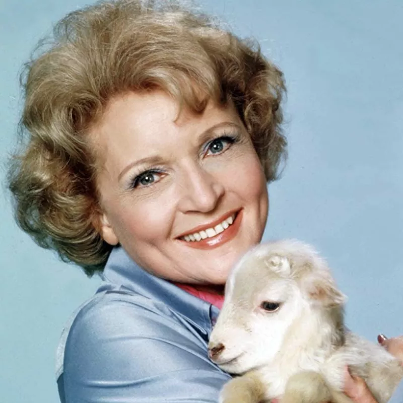 Betty White with a baby goat