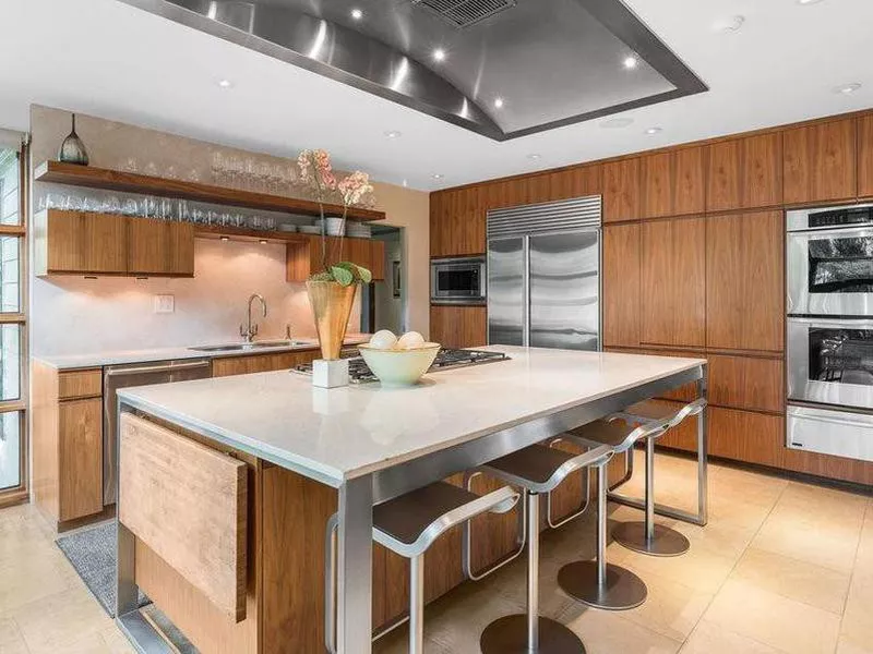 Midcentury modern kitchen with built-in wood shelving