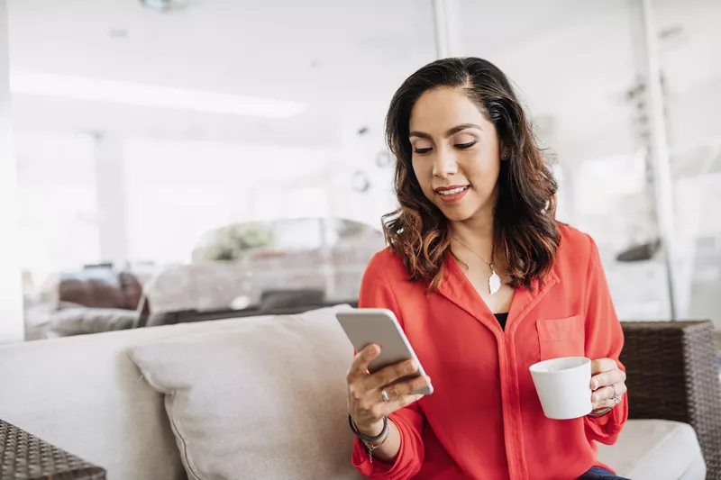 Woman working from home on her phone