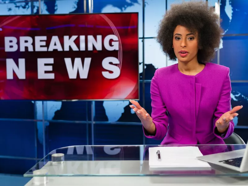 Female newsreader in the studio