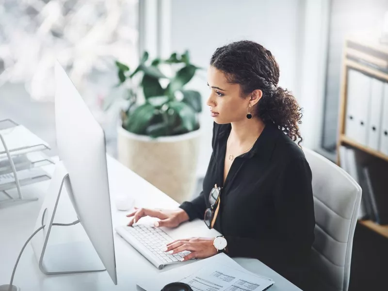 Captioner working on computer