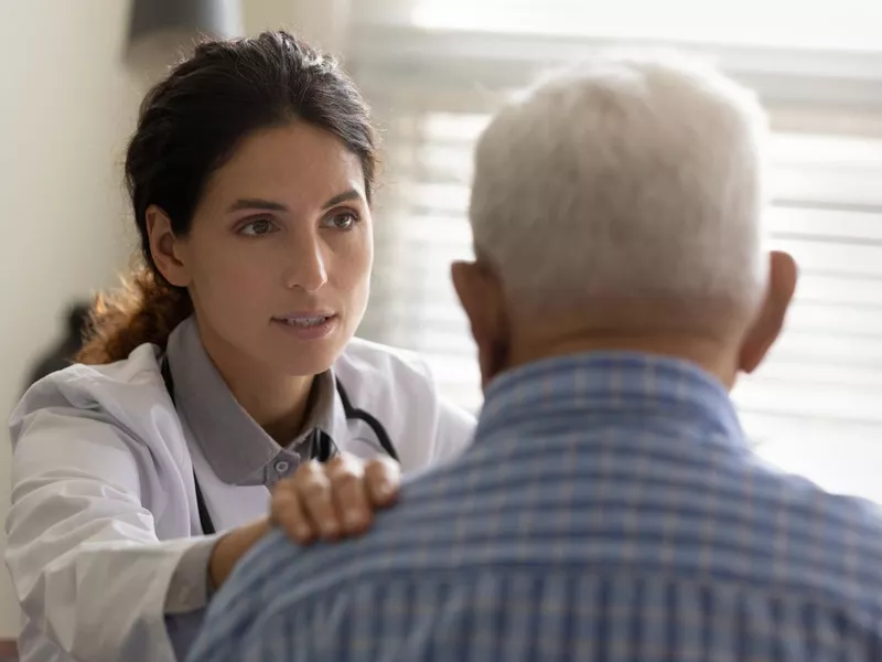 Oncologist with patient