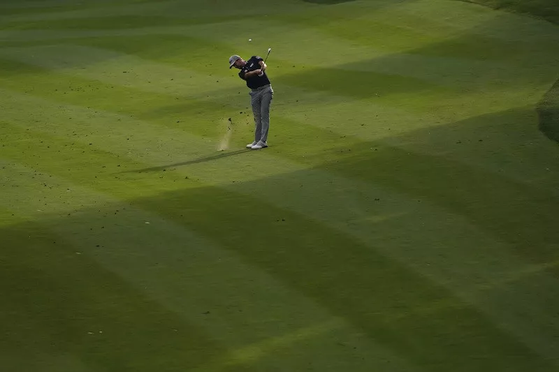 Webb Simpson hits 18th fairway