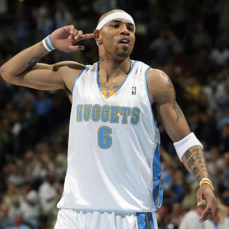 Denver Nuggets' Kenyon Martin gestures to crowd