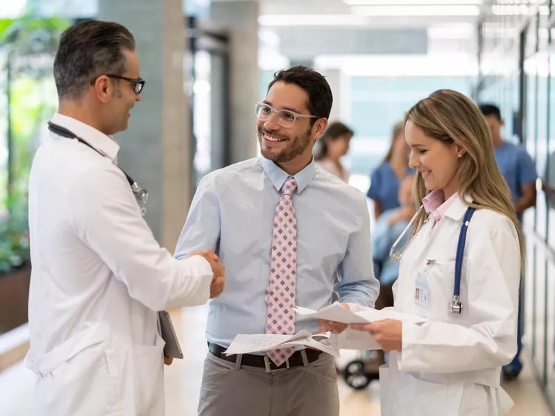 Hospital supervisor talking with doctors at a hospital