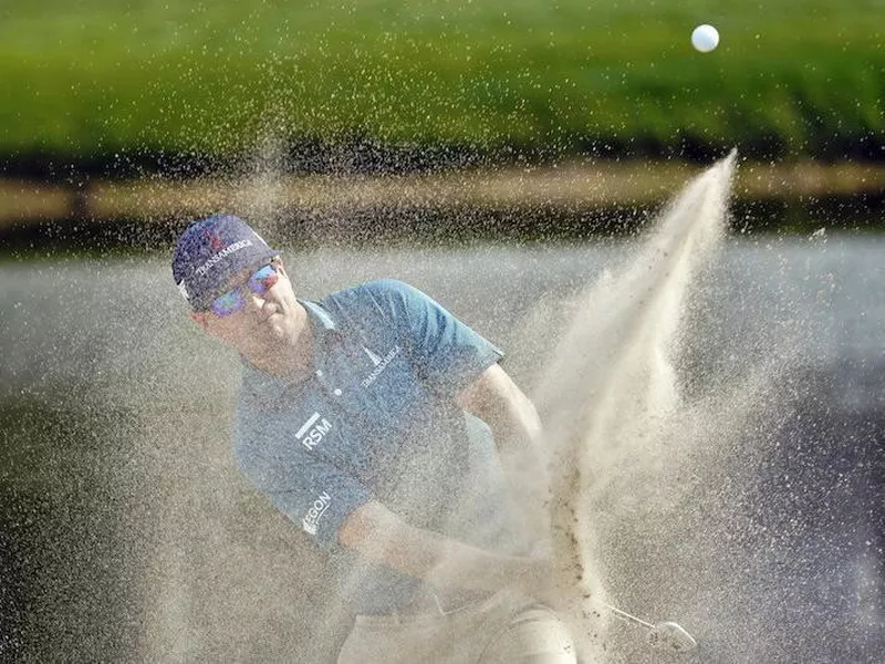 Zach Johnson blasts from sand trap