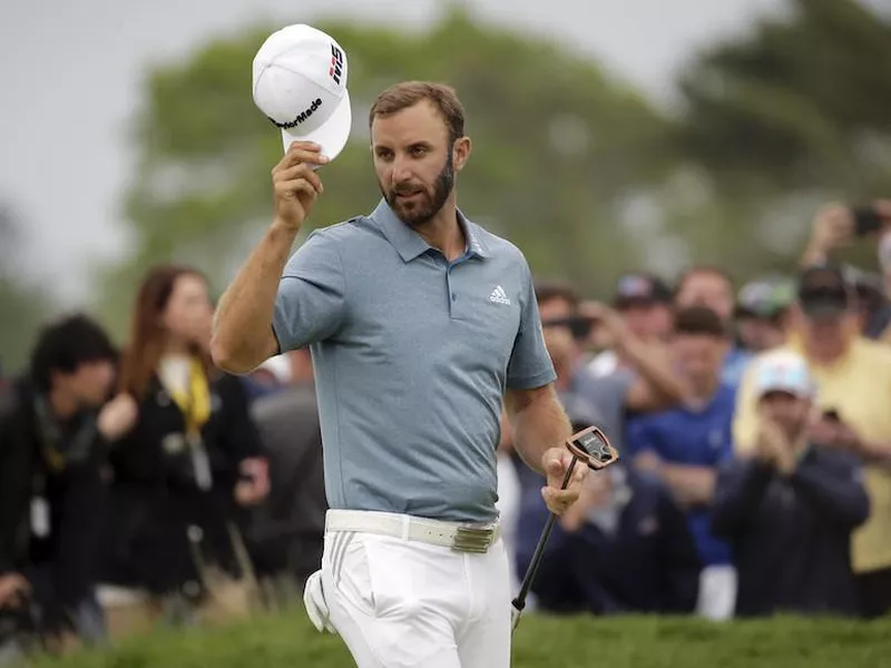 Dustin Johnson tips his hat