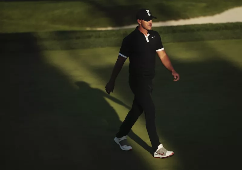 Brooks Koepka walks on 17th green