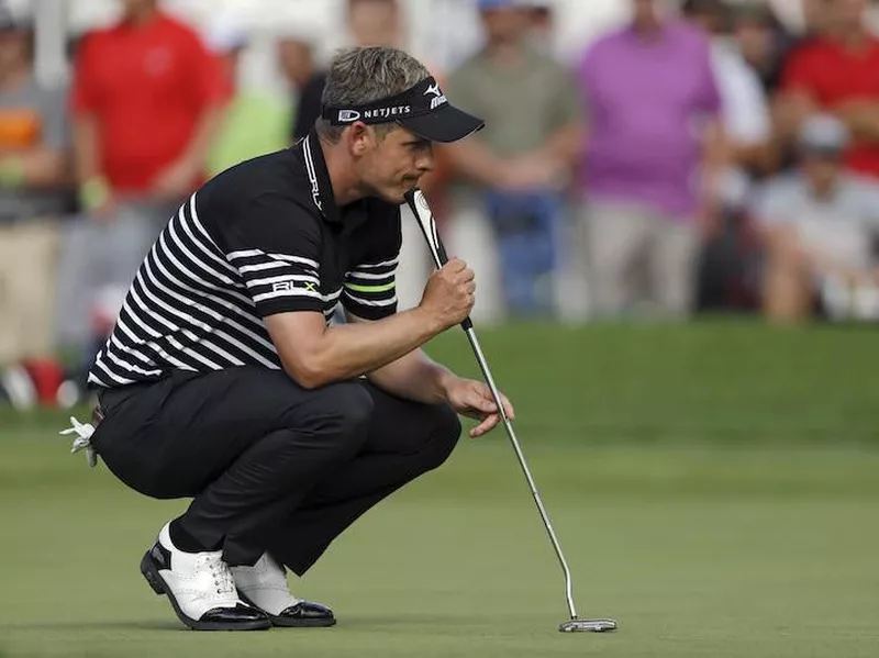 Luke Donald looks over his putt