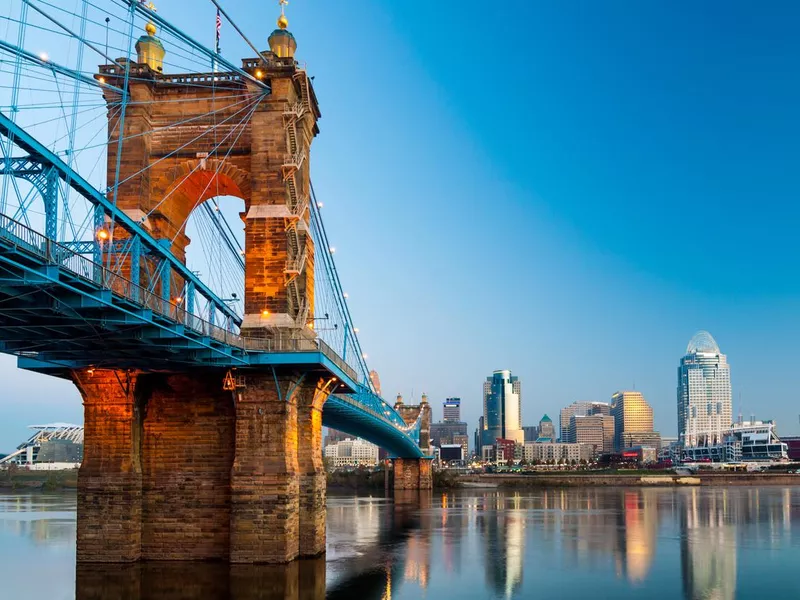 Cincinnati skyline and Roebling Suspension Bridge at dawn