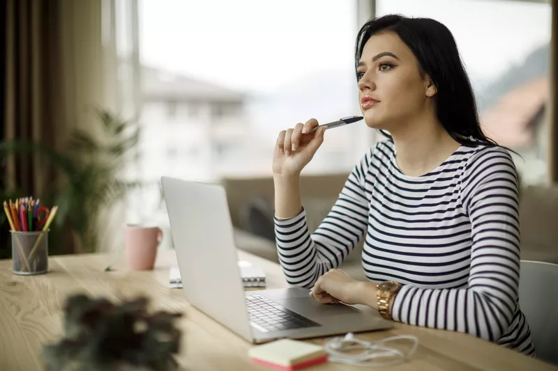 Young woman working at home