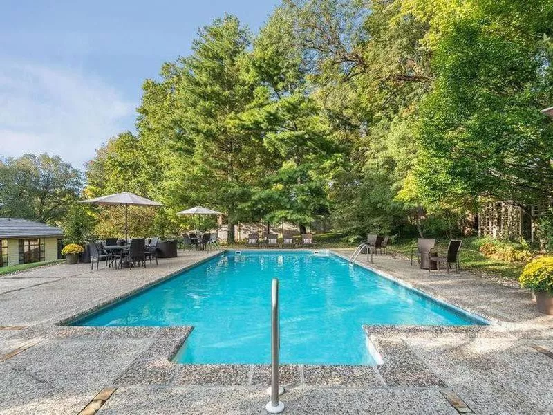 Pool with a large surrounding patio