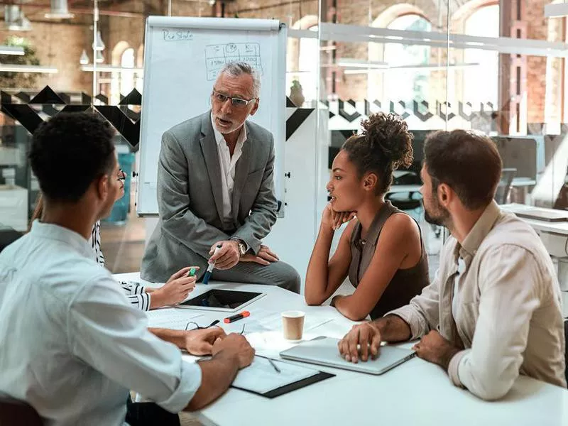 Older man and young coworkers