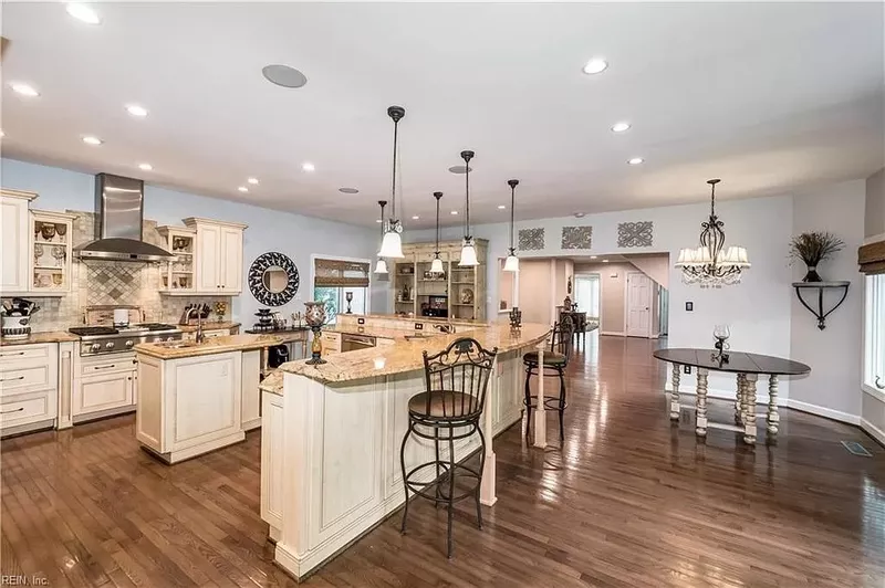 Large open floor plan kitchen with recessed lighting