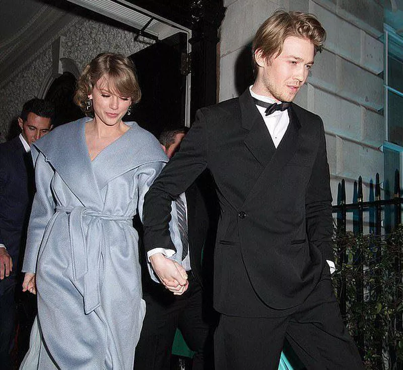 Taylor Swift and Joe Alwyn holding hands