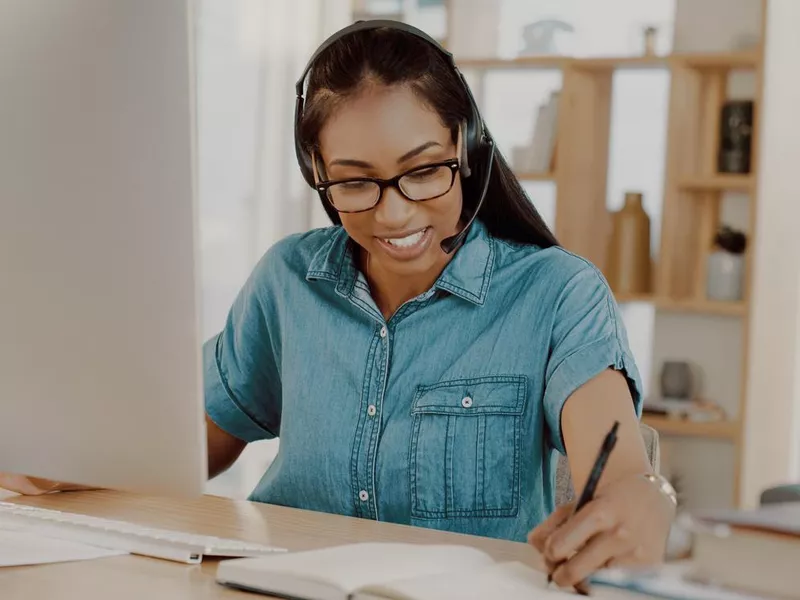 Woman customer service representative working at home