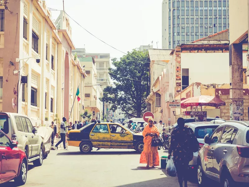 People working and traffic at Senegal capital Dakar, West Africa.