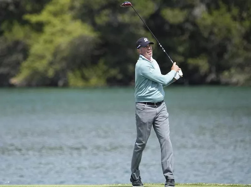 Matt Kuchar watches his drive