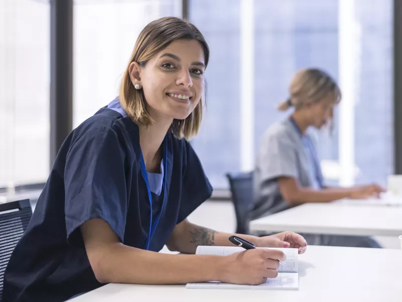 Nursing students studying in a classroom