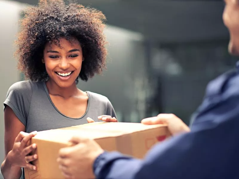 Woman happy to get a delivery