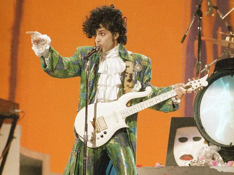 Prince playing guitar