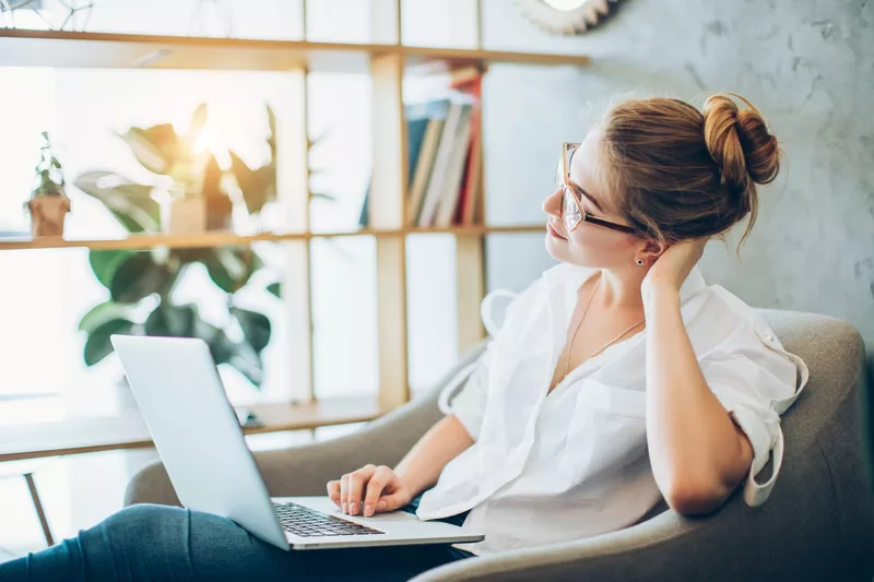 Young woman working in an alternative office